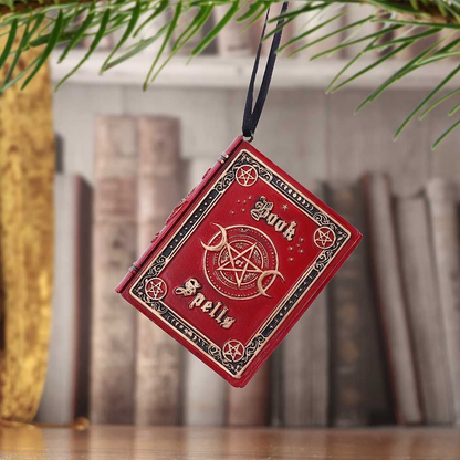 Nemesis Now Book of Spells Hanging Ornament. Red book shaped polyresin ornament with the words Book of Spells on the front