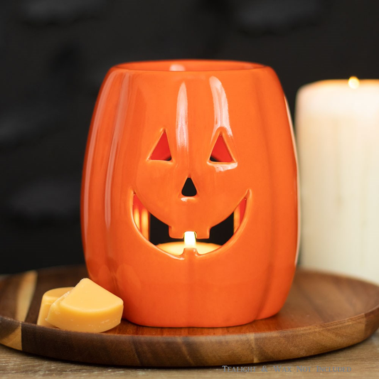 An orange pumpkin oil burner and...