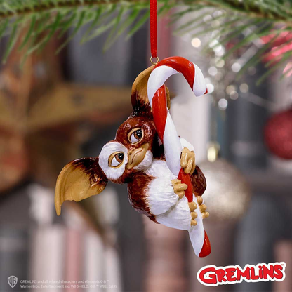 Nemesis Now Gremlins festive hanging ornament featuring Gizmo holding onto a red and white stripe candy cane. Christmas ornament 