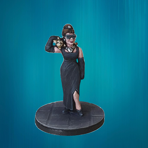 Audrey Hepburn a metal miniature by Bad Squiddo Games sculpted by Alan Marsh. A tabletop metal miniature for your gaming table and hobby needs to represent the star of stage and screen Audrey Hepburn