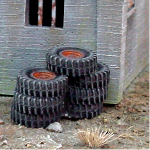 Tyrewalls by Crooked Dice, resin miniature representing a wall of tyres for you to add barricades, scatter and dressing your tabletop games.