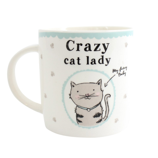 Add some whimsy to your morning routine with this Crazy Cat Lady white mug with adorable grey cat prints and light blue accents. Featuring a cute cat design and the words "Crazy Cat Lady" and "My Furry Baby,"