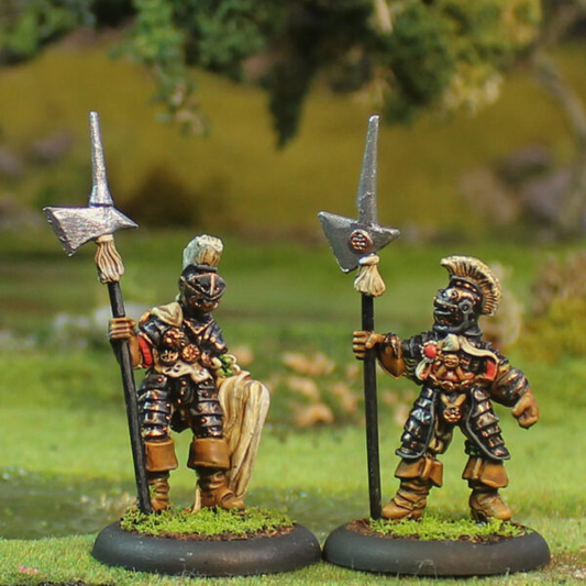 Alvi D’Arme 1 by Oakbound Studio. A pack of two lead pewter miniatures holding polearms, wearing armour and headdresses, great for your tabletop and RPGs. 