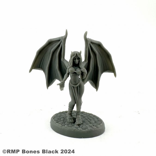 20350 Tirika Succubus by Reaper Miniatures from their Bones Black range sculpted by Bobby Jackson for your tabletop gaming needs. A wonderful gaming figure of a succubus with wings up, bra top and loin cloth with her hip out to one side for your RPGs and more