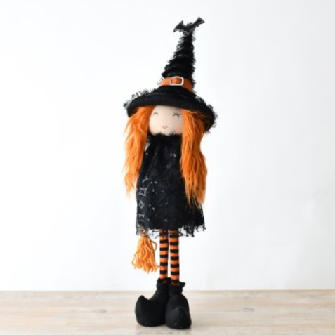 Get in the Halloween spirit with this Fabric Standing Witch With Broom. With orange hair, a black hat with bat detail, and striped orange and black legs, she's the perfect spooky decoration. Her adorable, smiling face and broom make her a must-have for any holiday display. Don't miss out on this quirky fun addition to your décor