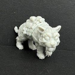 Sabretoothed Tiger chibi by Iron Gate Scenery.&nbsp; A printed resin miniature representing a cute chibi Sabretoothed Tiger carrying a load on its back making &nbsp;a characterful miniature for your tabletop games, Dungeons and Dragons (D&amp;D) or RPG game