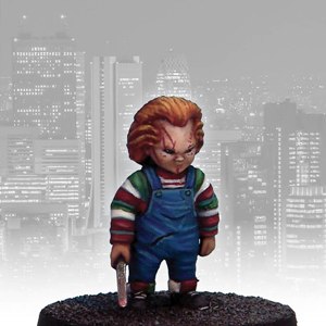 Killer Doll by Crooked Dice a white metal 28mm scale miniatures for your tabletop games representing an evil doll holding a knife and wearing dungarees