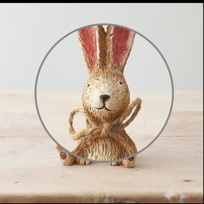 Sitting Rabbit With Bow. A cute bunny figurine sat with its legs out and front paws on the floor, a wonderful edition to your home decor or as a gift.  