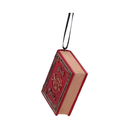 Nemesis Now Book of Spells Hanging Ornament. Red book shaped polyresin ornament with the words Book of Spells on the front