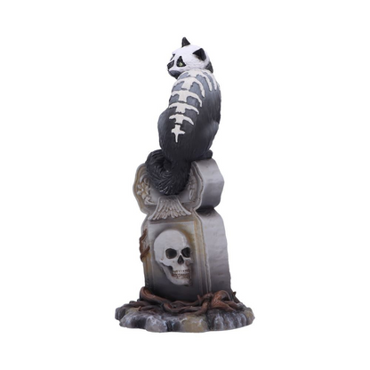 Gothic skull cat by Martin Handford from Nemesis Now. Perched on top of an ornate gravestone this black feline with green eyes and exposed skull and spine with add an unusual edition to your cat figurine collection for Halloween and all year round.