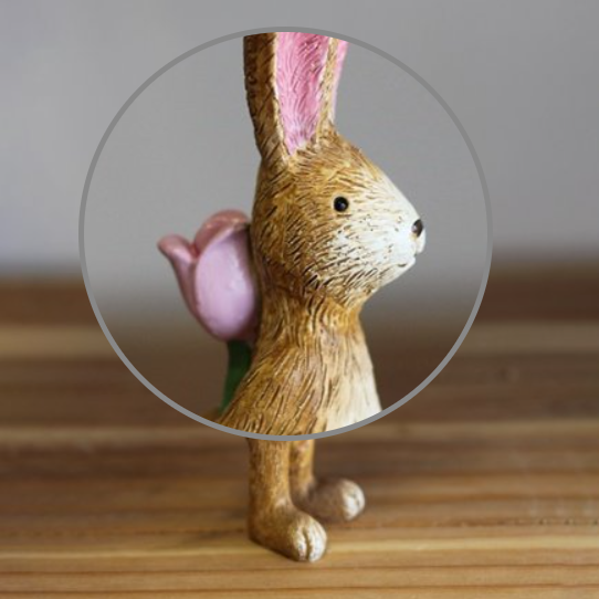 Standing Rabbit With Rose. A cute bunny figurine standing and holding a pink rose behind its back making an adorable gift or edition to your homeware decoration.