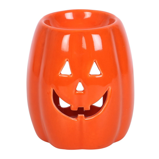 An orange pumpkin oil burner and...