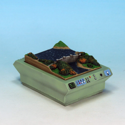 Hoover Dam Map Table by Crooked Dice, a resin miniature representing a secret bases table with the famous landmark helping your evil character plan their latest world dominating plot or for your hero to create an international rescue. Approximately 60mm x 43mm&nbsp;