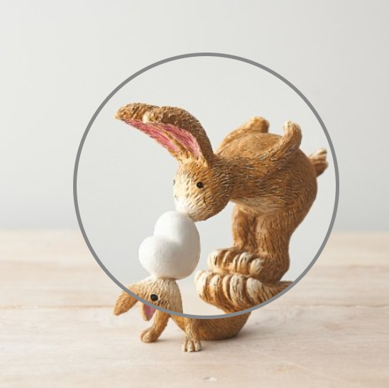 Wonderful bunny ornament of a rabbit and baby bunny adorably posed with the baby bunny standing on the rabbits feet and nose kissing a heart. A sweet figurine  that would make a beautiful gift or edition to your own home. 