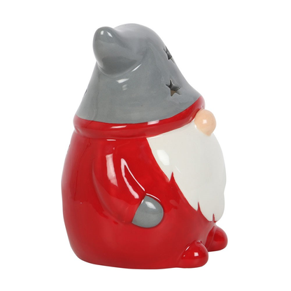 Red & Grey Gonk Tealight Holder. A wonderful Christmas Gonk / Gnome to help bring festive glow to your home, place a standard tealight inside and see the soft glow through the star shapes in the hat and back.