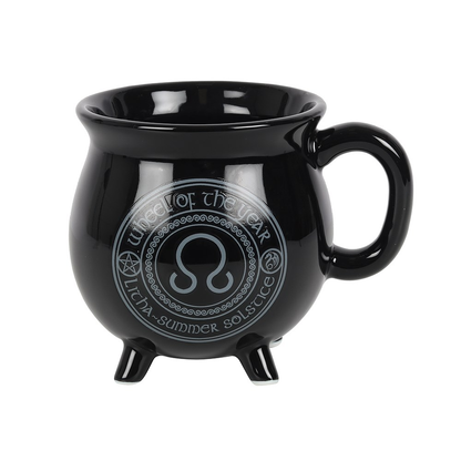 Litha Colour Changing Cauldron Mug By Anne Stokes. This black cauldron mug features Litha the symbol of the Summer Solstice 