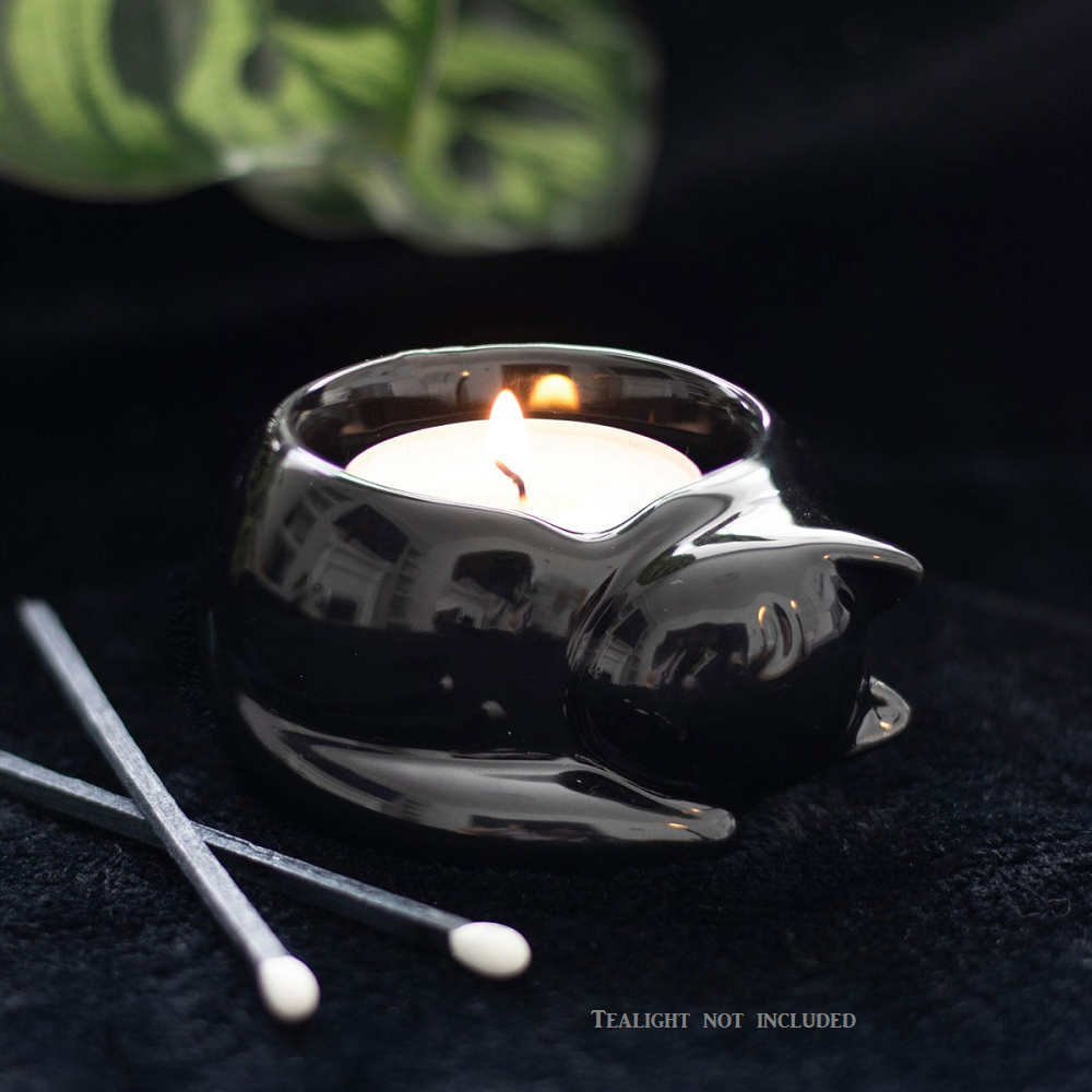 A black tealight holder representing a curled up and cosy black cat making a lovely home décor accessory, gift or ornament.