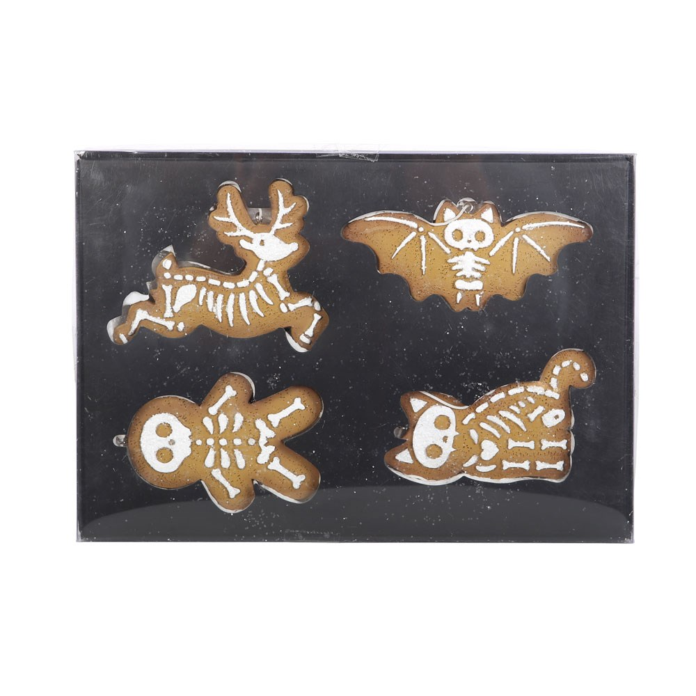 Set of four Creepy Skeleton Cookie Ornaments. A spooky take on the traditional gingerbread cookie ornaments featuring a gingerbread man, skeleton reindeer, bony bat and creepy cat