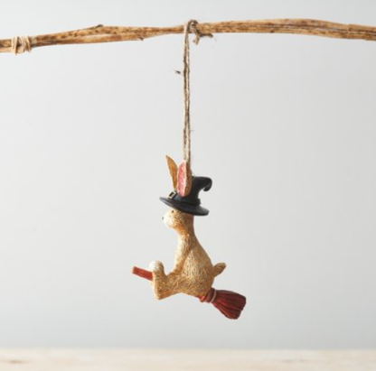 Flying Witch Rabbit. A fun and charming resin bunny sat in a broomstick wearing a witches hat