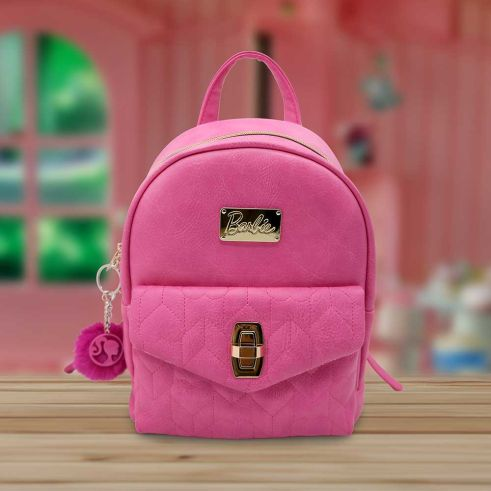 Barbie Backpack. A fantastic gift for any Barbie fan with classic Barbie glamour, a hot pink exterior with gold plated Barbie logo on the front, adjustable shoulder straps, quilted front pouch with gold fastening and top carrying handle making an eye catching edition to your outfit while being useful and practical