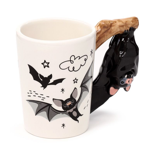 Bat shaped handle mug. A cream c...