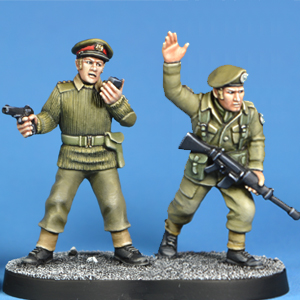 Army Specialists by Crooked Dice, two metal miniatures depicting soldiers in various poses including raising a hand in a hold motion and talking on a walkie talky 