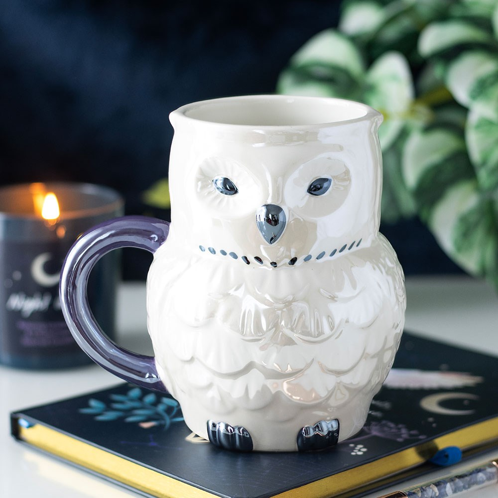 Owl Shaped Iridescent mug from the night flight range. A beautiful owl shaped mug with a dreamy iridescent glaze.