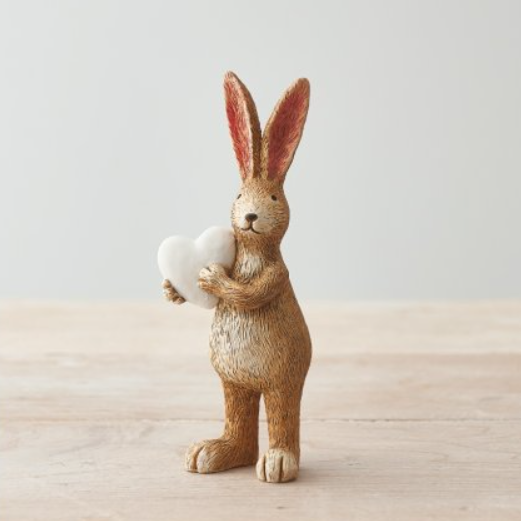 A charming standing bunny rabbit ornament with cute little tail and holding a heart making a prefect gift or a wonderful edition to your own rabbit collection