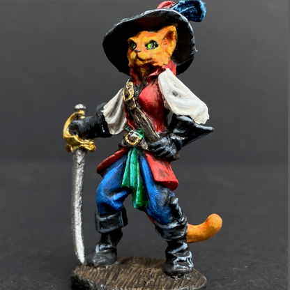 Hand painted debonair cat from the Reaper Miniatures range. Mrs MLG has painted this catfolk cavalier as a ginger cat with a blue, green and red colour scheme clothing having black hat, boots and gloves. 