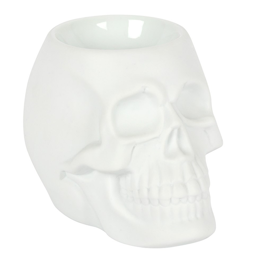 A matt white skull oil burner