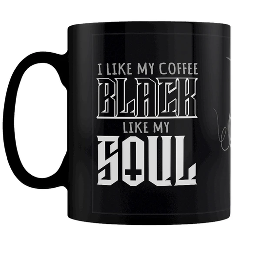 A black mug featuring a flourish...