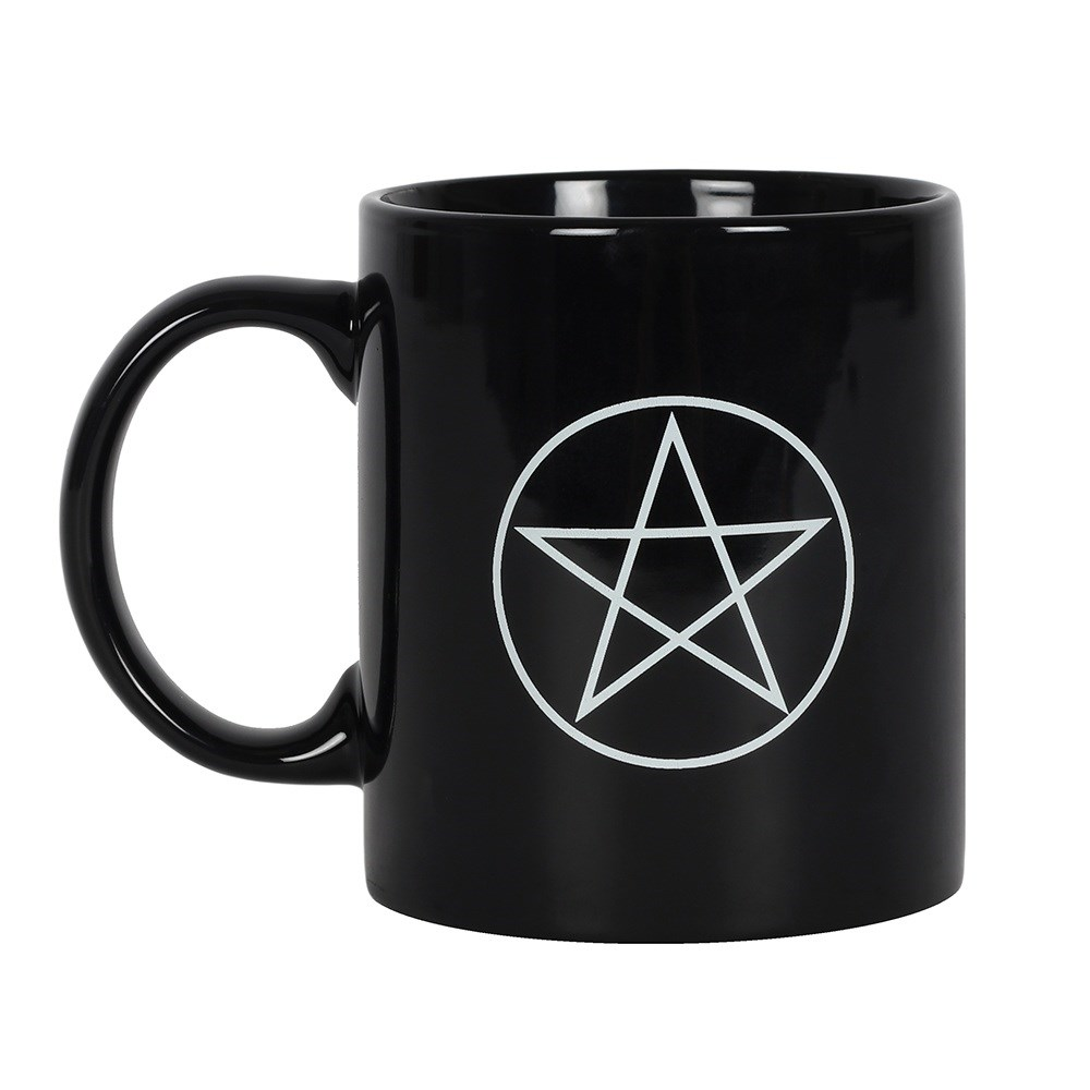 A ceramic black mug with a white design depicting the Wiccan pentagram five pointed star 