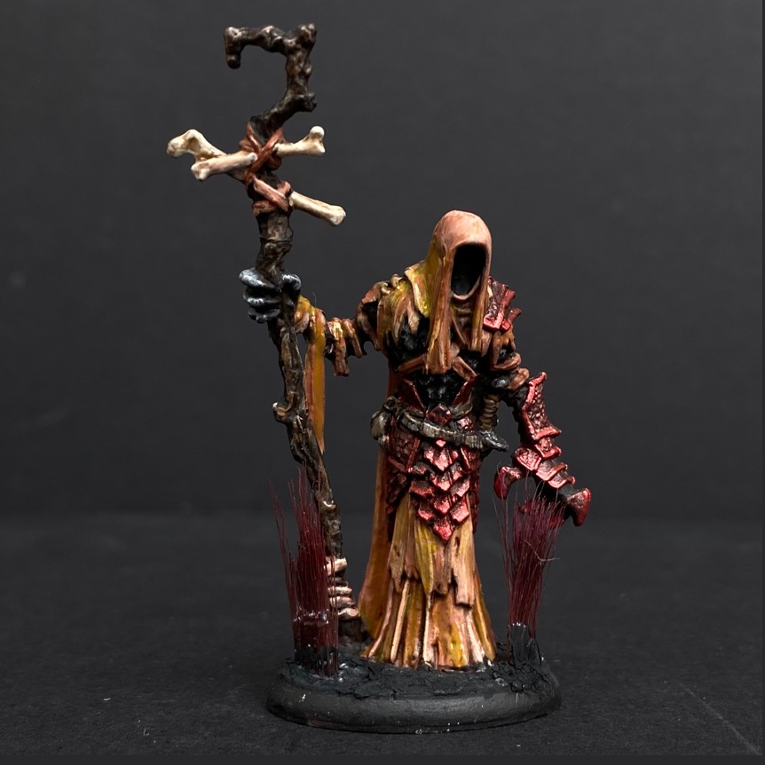 Hand painted necromancer from the Reaper Miniatures range. Mrs MLG has hand painted this undead miniature that has armour on one arm and bandages on the other. It also has long tufts on the base.  