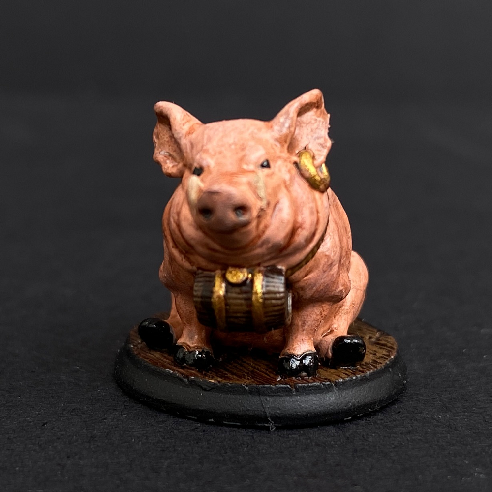 Hand painted pig with a barrel from the Reaper Miniatures range. Mrs MLG has painted this cute little pig with pink colouring, gold earing and black hooves.