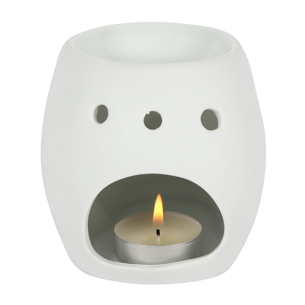 A matt white skull oil burner