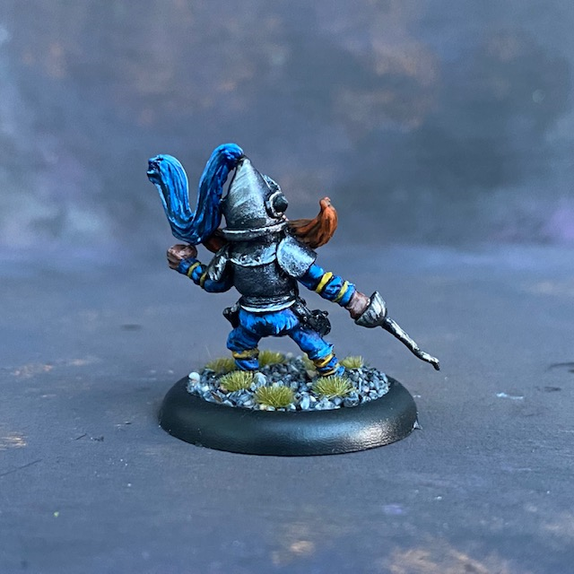 The Knight by Northumbrian Tin Solider from their Nightfolk range pre painted by Mrs MLG.  A metal miniature knight with a blue adornment to his helm and a rather excellent moustache. 