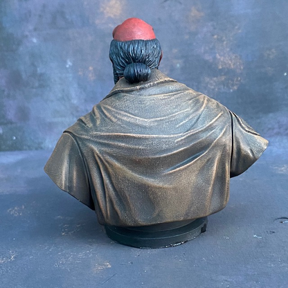 A Mantic Games bust of Hell Boy in resin with his classic manbun and brown jacket