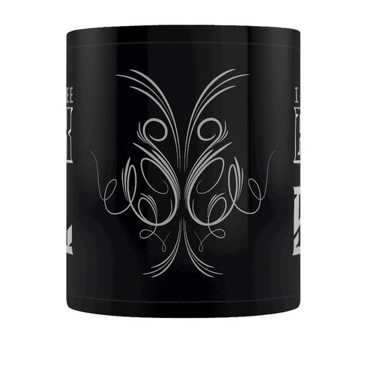 A black mug featuring a flourish...