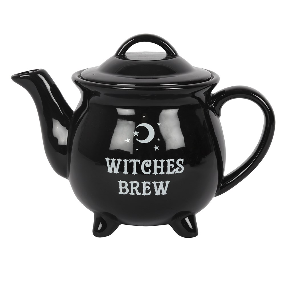 black teapot has white writing 'Witches Brew' and a white crescent moon