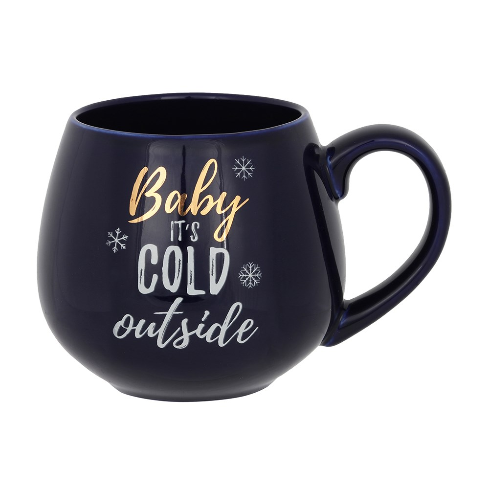 A beautiful rich blue rounded mug with gold and white writing saying 'Baby It's Cold Outside'.