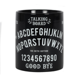 A ceramic black mug with white writing featuring the classic Ouija / talking board design including letters, numbers, yes, no and goodbye