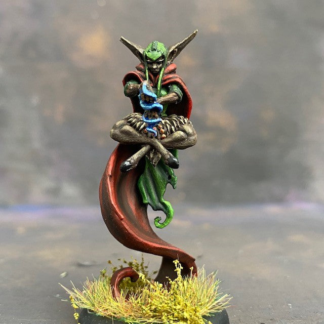 Raegan Priestess from the Monnstone malachite mystics troupe box pre painted by Mrs MLG. This Leshavult priestess miniature is painted with reds, browns, blue and greens.