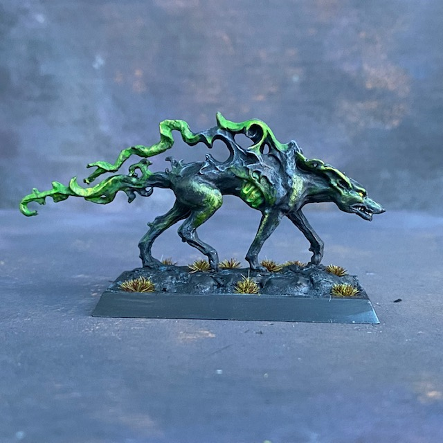 Hound Of Judgement by Reaper Miniatures pre painted by Mrs MLG.  A metal miniature  of a stalking canine with magical smoke billowing from its body as it hunts for in justice.