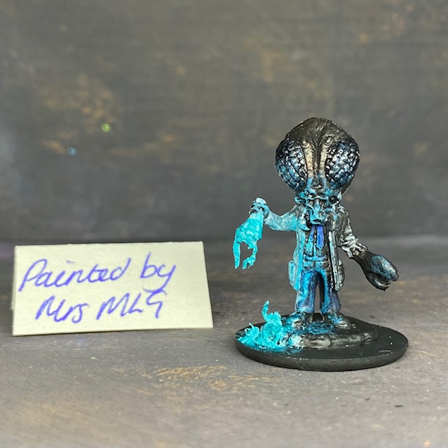 A Reaper Miniatures bonesylvanian Jaques hand painted by Mrs MLG. This scientist may have taken his experiments too far as he now has the head and one hand of a bug. Mrs MLG has painted this little fella with his glass flask broken and the contents spilling out onto the floor. 