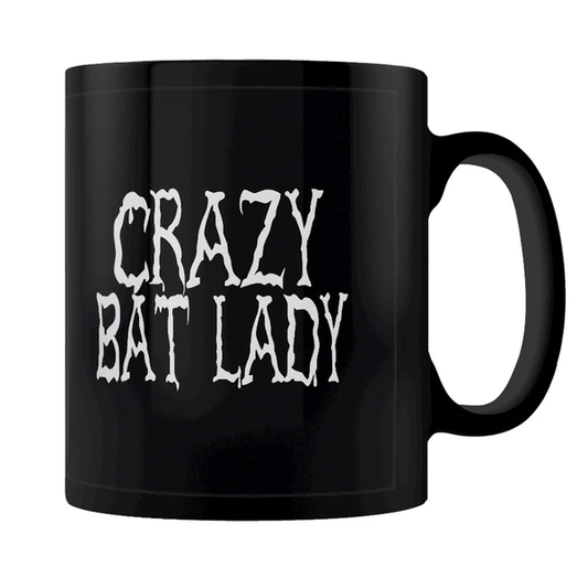 A black mug featuring a cute pur...