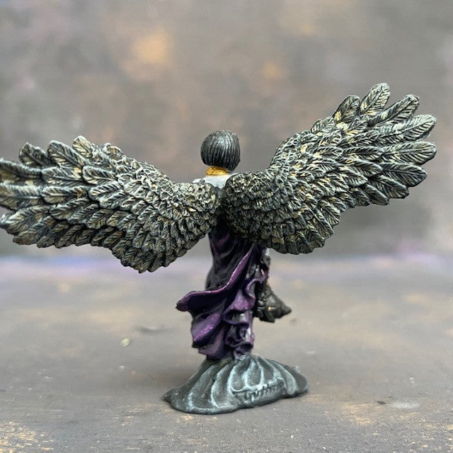 Angel of Shadows from the reaper miniatures bones range pre painted by Mrs MLG. This angelic miniature is painted with purples, blues, grey and golds, she holds a sword in one hand and a lantern in the other.