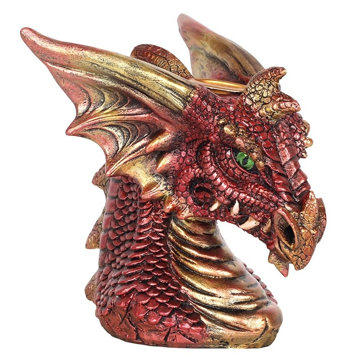 A red and gold dragon head with green eyes incense burner 