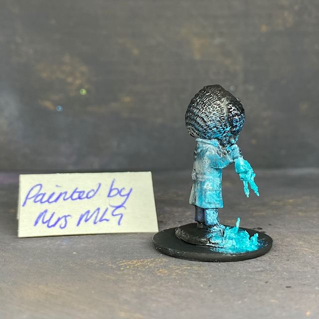 A Reaper Miniatures bonesylvanian Jaques hand painted by Mrs MLG. This scientist may have taken his experiments too far as he now has the head and one hand of a bug. Mrs MLG has painted this little fella with his glass flask broken and the contents spilling out onto the floor. 