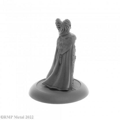 Anthanelle Female Elf Wizard from the Dark Heaven Legends metal range by Reaper Miniatures, wearing a robe and holding an ornate staff in one hand and the other by her side Anthanelle strikes a regal pose 