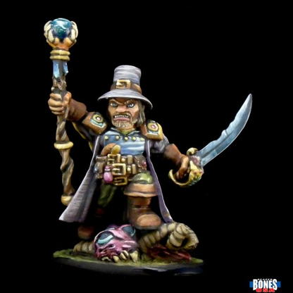 Arkus Harn dwarf witch hunter reaper miniatures 30011. sword in one hand and a staff in the other he stand with one foot aloft on a recently slain creature.